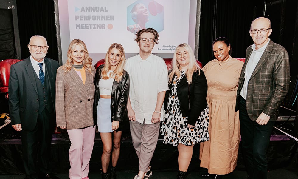 John F Smith OBE (PPL) with APM panellists Reevah (Aoife Boyle), Aine Cronin-McCartney, Chris W Ryan, Jo Wright, Titania Altius (PPL) and Peter Leathem OBE (PPL) at the 2023 Annual Performer Meeting